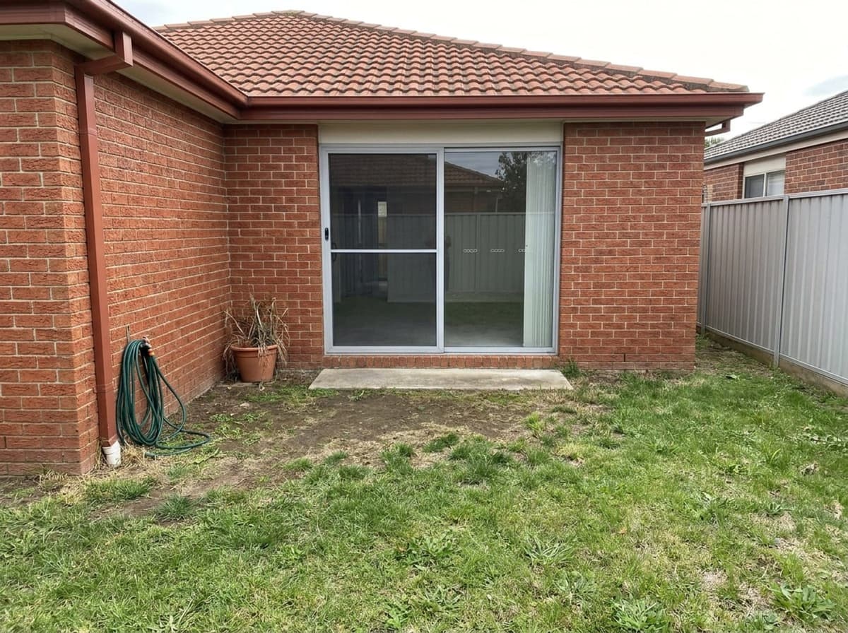 AI-generated photo of the back of a red-brick veneer house in Melbourne, before the deck